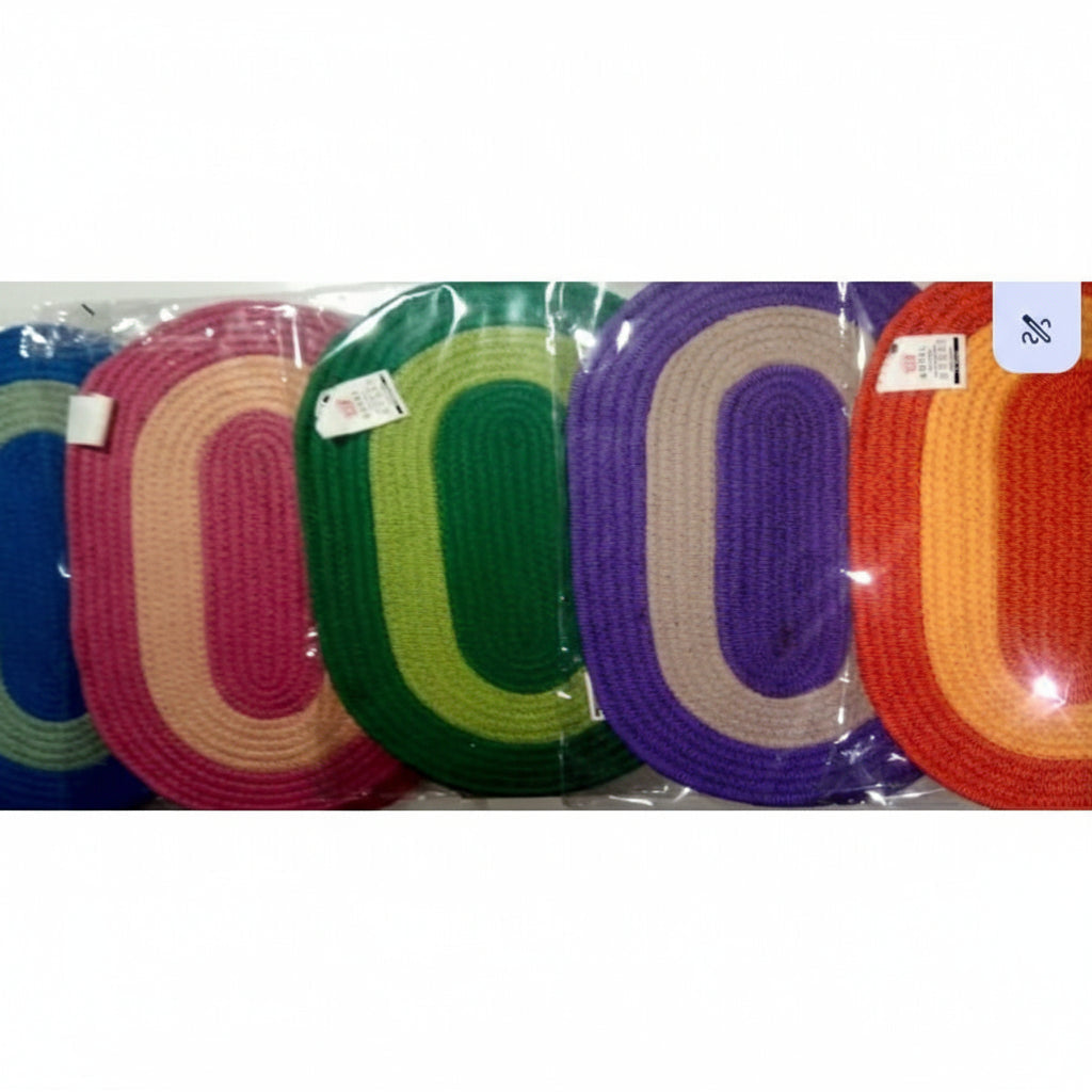 Set of colorful braided rugs in a clear package on a white background