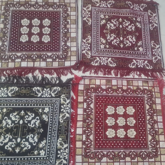 Set of patterned fabric squares with intricate designs on a checkered background