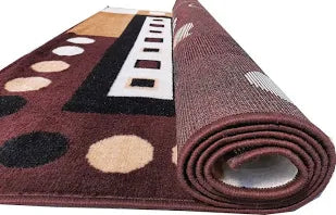 Rolled-up multicolored patterned rug on a white background