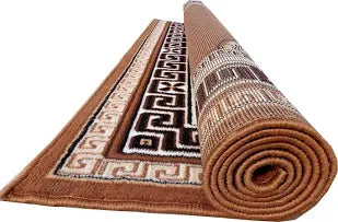 Roll of patterned rug with intricate design on a white background