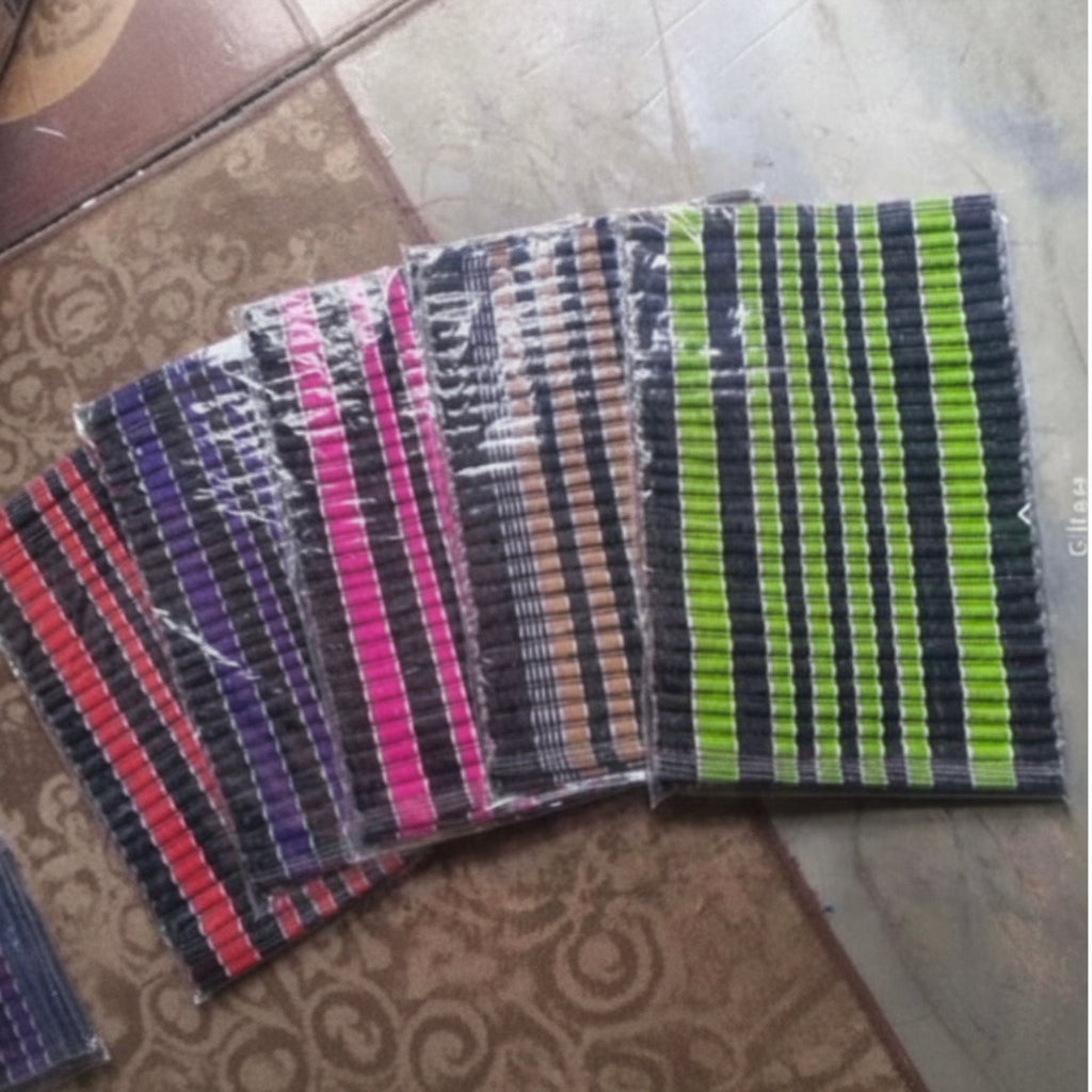 Colorful woven mat on a textured surface