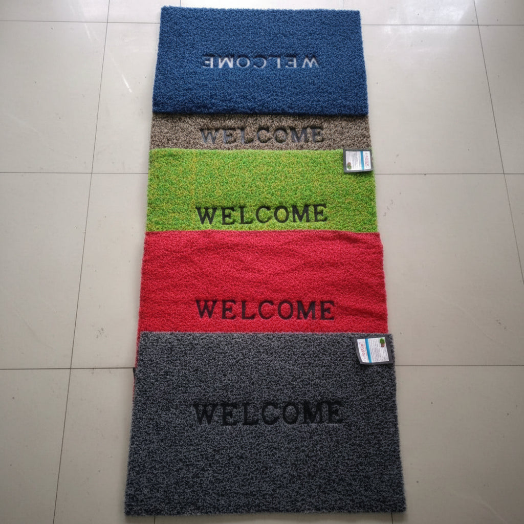 Set of four colorful doormats with 'WELCOME' text on a tiled floor.