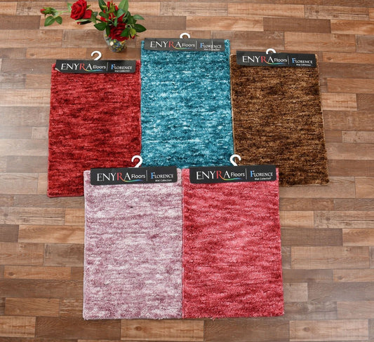 Color samples of ENYRA Floors Florence on a wooden floor background