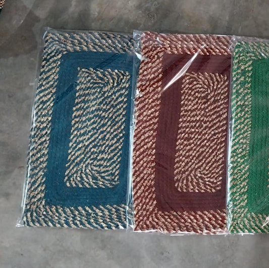 Set of four woven name tags in different colors on a gray background