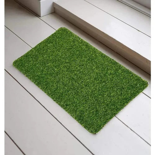 Green doormat on a white wooden floor