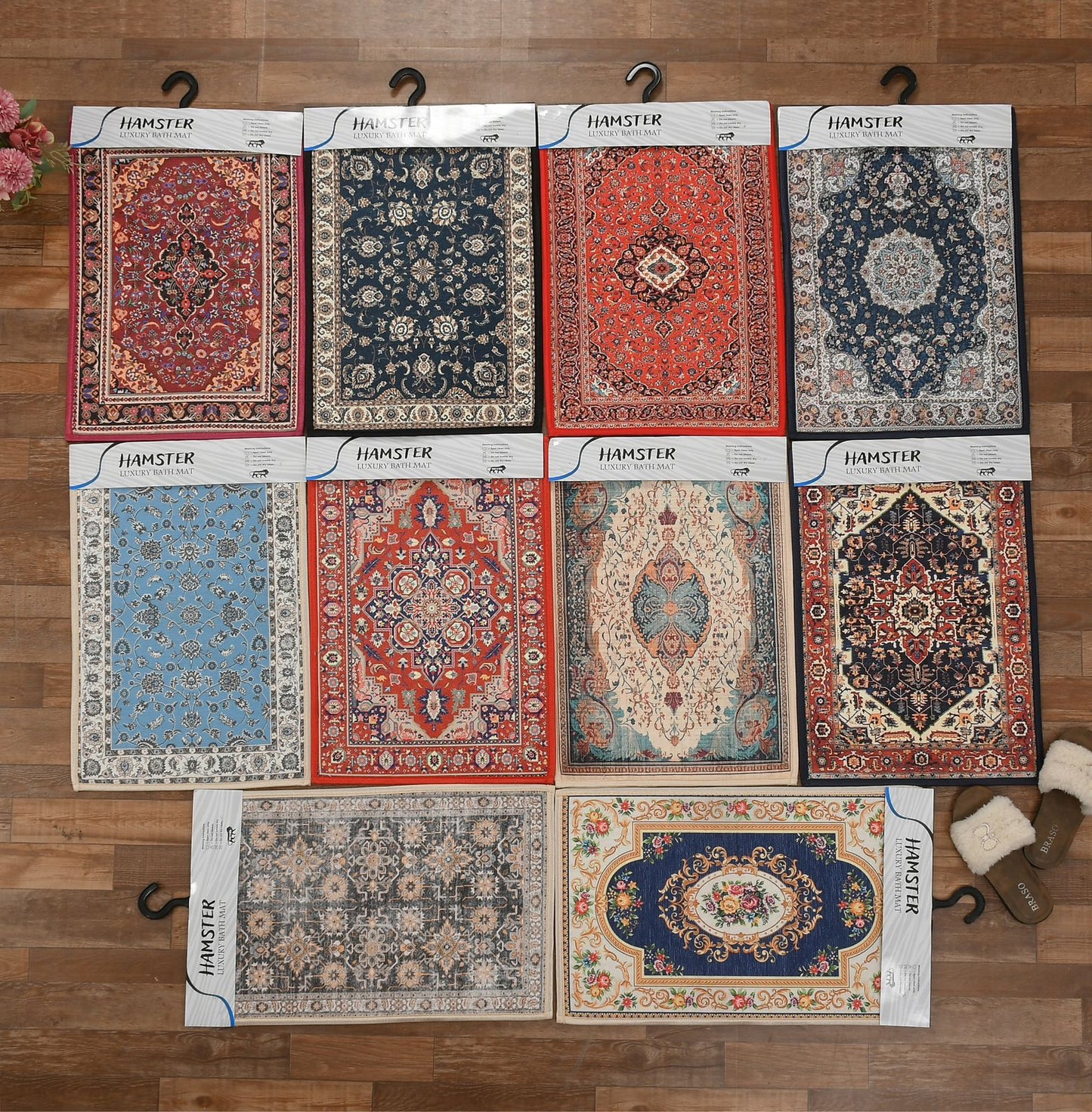 Collection of small rugs with intricate patterns on a wooden floor.