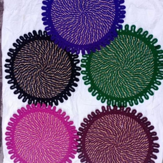 Colorful circular coasters on a white surface