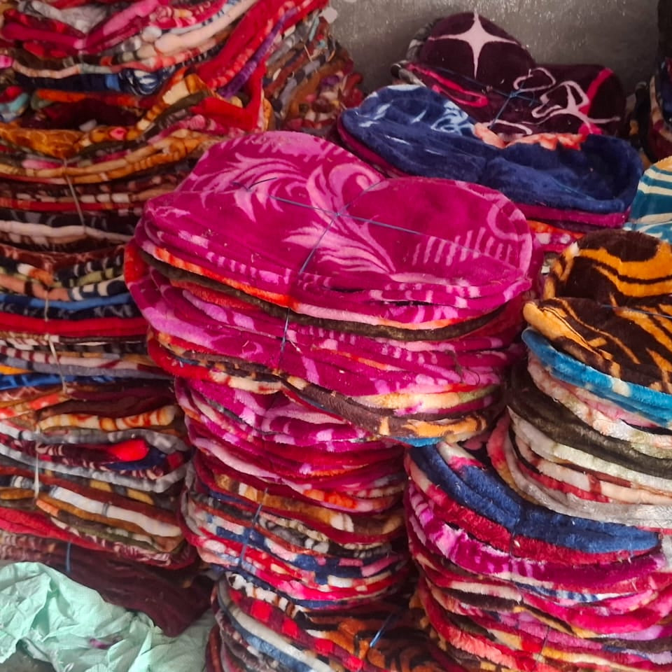 Stacks of colorful fabric headbands in various patterns and colors.