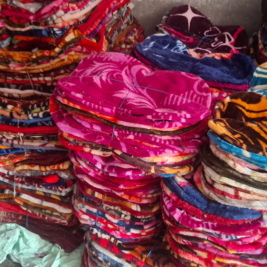Stacks of colorful fabric headbands in various patterns and colors.